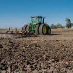 Tractor plowing a field