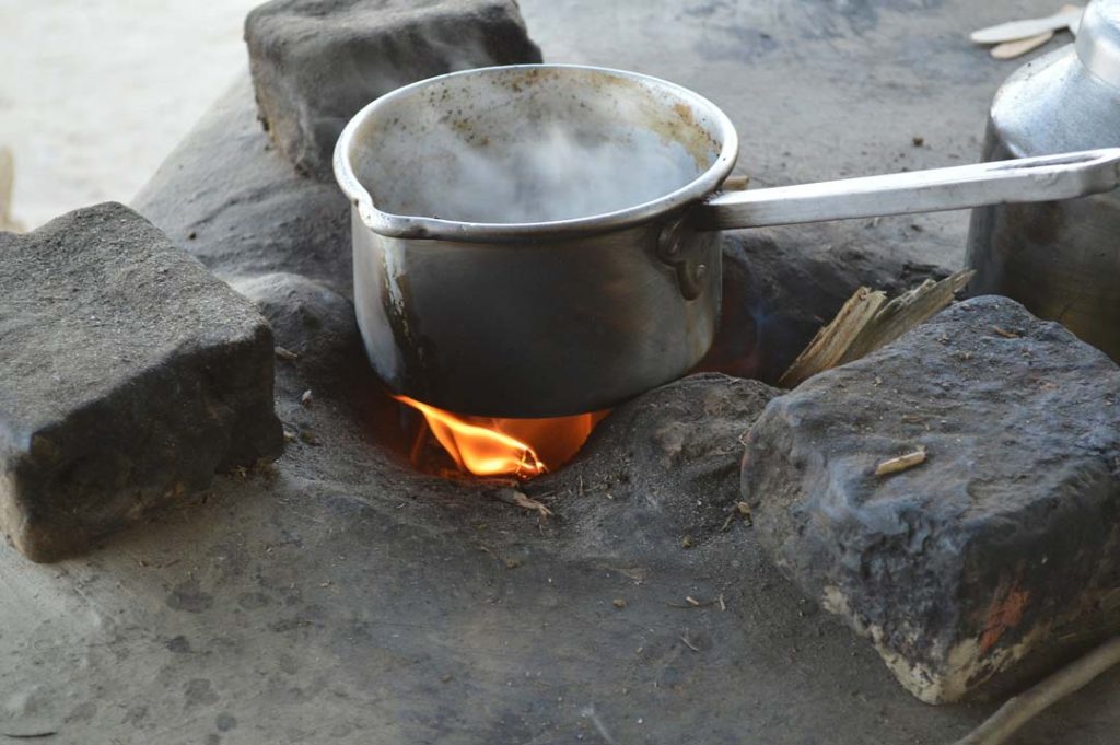 Cooking fire over rock