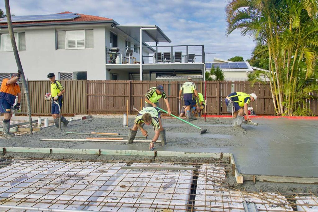 Workers building a foundation