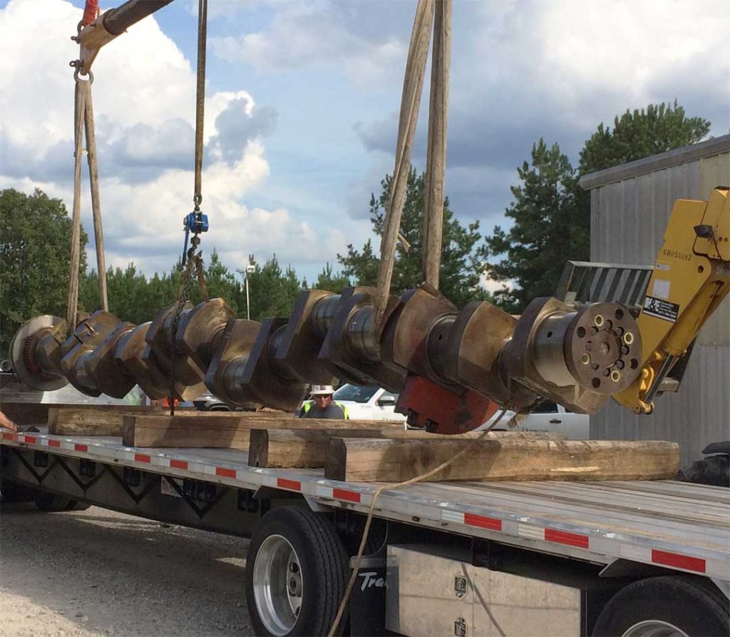 Crankshaft being loaded onto a truck